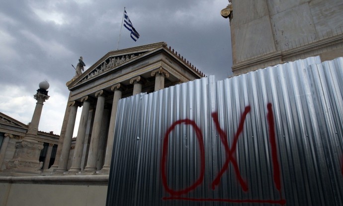 The word OXI (No) is written on a wall in front of the Greek Academy in Athens, Greece. Photograph: Simela Pantzartzi/EPA
